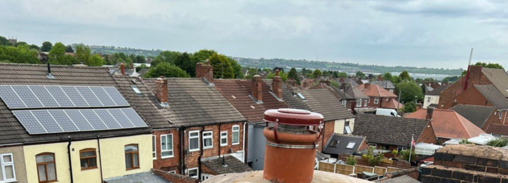 This is a photo taken from a roof which is being repaired by LS Roofing Uxbridge, it shows a street of houses, and their roofs